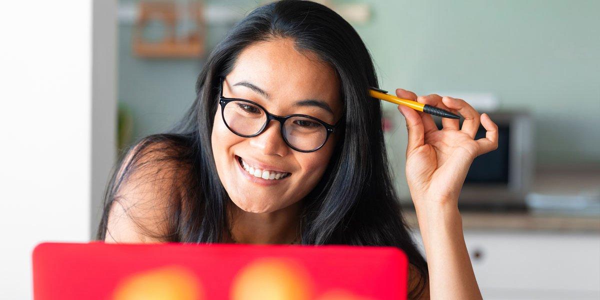 woman at laptop smiling